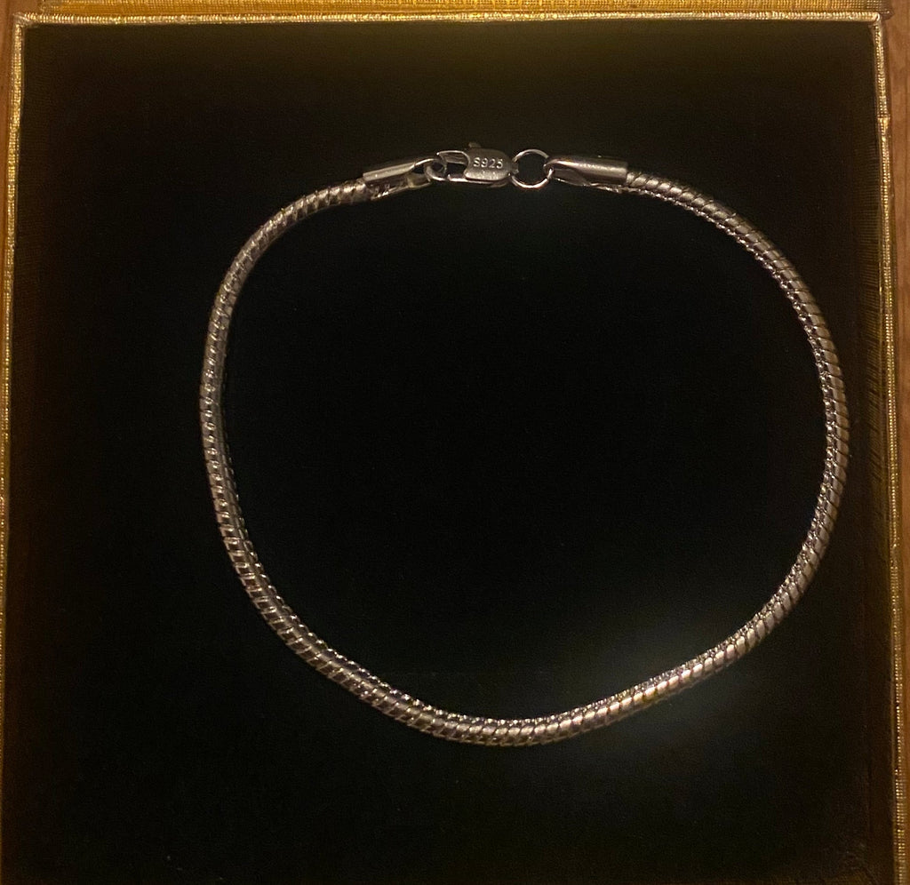 Sterling silver snake bone charm bracelet