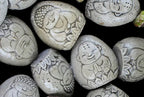 5 piece buddha carved fossil ornaments in bag