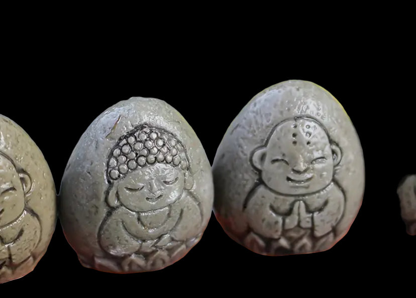 5 piece buddha carved fossil ornaments in bag